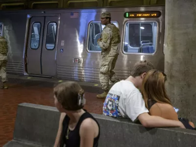 Members of the South Carolina National Guard patrol the platform of the Washington Metro Gallery Place station in Washington, Sunday, Aug. 24, 2025. (AP Photo/Rod Lamkey, Jr.)