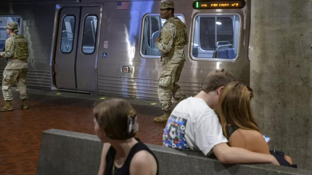 Members of the South Carolina National Guard patrol the platform of the Washington Metro Gallery Place station in Washington, Sunday, Aug. 24, 2025. (AP Photo/Rod Lamkey, Jr.)