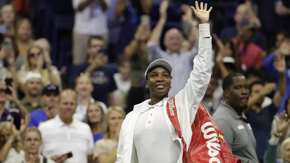 Venus Williams, of the United States, waves to fans after being defeated by Karolina Muchova, of the Czech Republic, during the first round of the U.S. Open tennis championships, Monday, Aug. 25, 2025, in New York. (AP Photo/Adam Hunger)