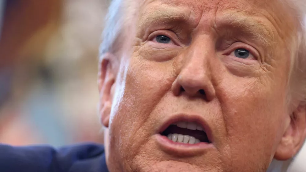 FILE PHOTO: U.S. President Donald Trump delivers remarks in the Oval Office at the White House in Washington, D.C., U.S., August 14, 2025. REUTERS/Kevin Lamarque/File Photo