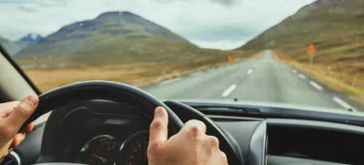 PYTTDD travel, driving car on a beautiful scenic road in Iceland