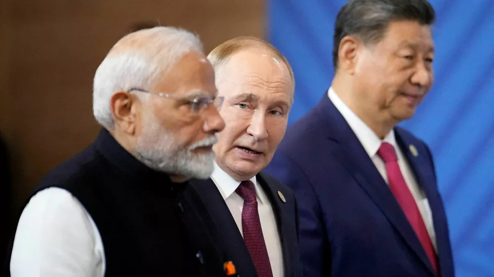FILE PHOTO: Indian Prime Minister Narendra Modi, Russian President Vladimir Putin and Chinese President Xi Jinping attend a family photo ceremony prior to the BRICS Summit plenary session in Kazan, Russia, Wednesday, Oct. 23, 2024.   Alexander Zemlianichenko/Pool via REUTERS/File Photo