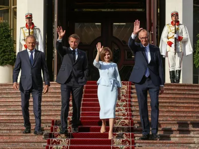 Poland's Prime Minister Donald Tusk, France's President Emmanuel Macron, Moldovan President Maia Sandu, and Germany's Chancellor Friedrich Merz walk after a meeting at the Presidential Palace in Chisinau, Moldova, August 27, 2025. REUTERS/Vladislav Culiomza   TPX IMAGES OF THE DAY