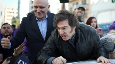 Argentina's President Javier Milei speaks to the media, while standing on a vehicle to attend a La Libertad Avanza party rally with lawmaker Jose Luis Espert, ahead of legislative elections in the province of Buenos Aires, in Lomas de Zamora on the outskirts of Buenos Aires, Argentina, August 27, 2025. REUTERS/Agustin Marcarian   TPX IMAGES OF THE DAY