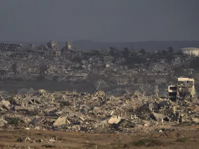 Buildings that were destroyed during the Israeli ground and air operations stand in the Gaza Strip as seen from southern Israel, Thursday, Aug. 28, 2025. (AP Photo/Maya Levin)