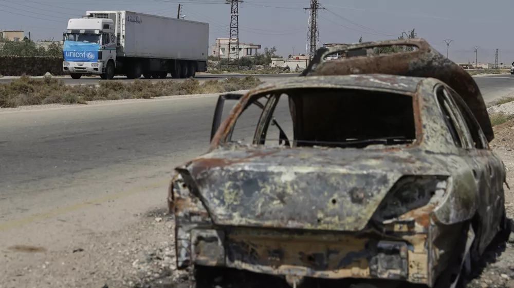 A truck carrying U.N. humanitarian aid heads toward Sweida city, southern Syria, Thursday, Aug. 28, 2025. (AP Photo/Omar Sanadiki)