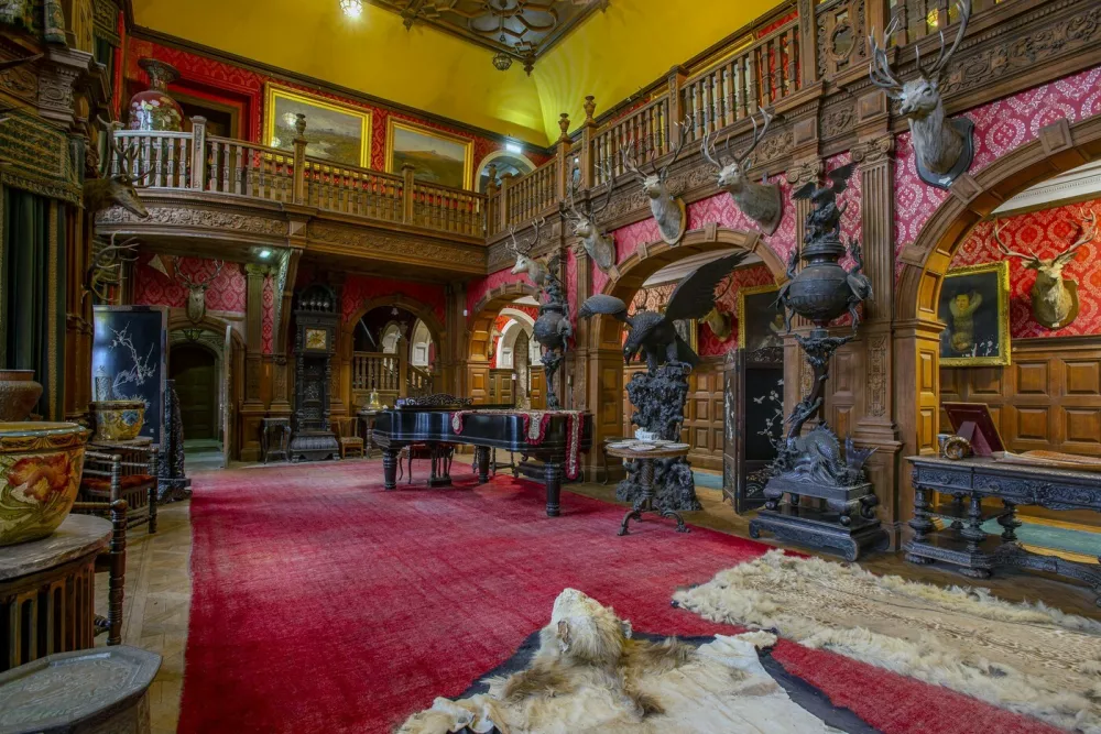 Grand Hall, Kinloch Castle. See SWNS story SWOCcastle. July 29, 2021.One of Prince Charles' favourite castles is looking for a new owner to save it from ruin as the iconic landmark crumbles in need of repair. Kinloch Castle on the Island of Rum in Scotland is on the market for a new owner who could put the money required into fixing up the crumbling castle. With a nominal value of just &pound;1, this is an extremely rare opportunity to take ownership of a 120-year-old castle that Prince Charles himself has been passionate about saving. Repairs on the crumbling turreted red-sandstone house are estimated at an eye-watering &pound;20 million to restore the castle to it's former glory. A private individual or a charity, foundation or private company who can provide such an amount for the castle repairs are in with a chance of owning the incredible house. Any new hopeful owners will have to prove that they have the resources to save this Category A landmark and show plans for bettering the future of the small isle where the castle sits.,Image: 624153007, License: Rights-managed, Restrictions: This image is not available for use at a stock rate unless with prior agreement. This image hereby disclosed to your organisation is so disclosed on the condition that your organisation will take all steps necessary to ensure that any identifiable personal data is processed in full compliance with the Data Protection Act 2018follow us on twitter - @swnsbrowse our website - swns.comemail pix@swns.com, Model Release: no