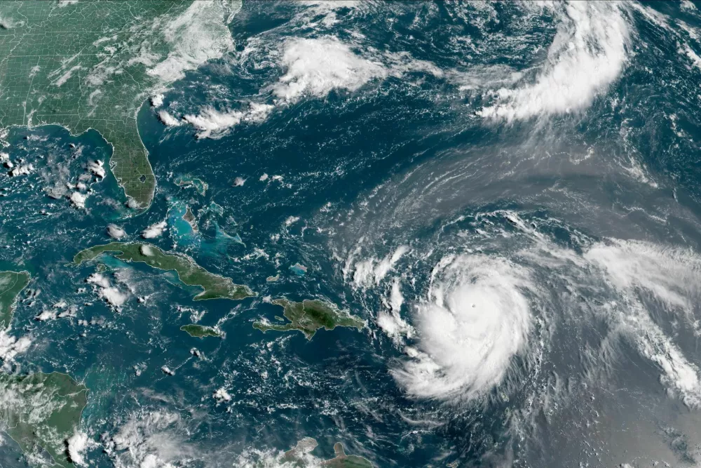 Hurricane Erin, which is the first hurricane of the 2025 Atlantic season and has developed into a dangerous Category 4 hurricane, moves westward near Puerto Rico in a composite satellite image August 16, 2025. CIRA/NOAA/Handout via REUTERS  THIS IMAGE HAS BEEN SUPPLIED BY A THIRD PARTY