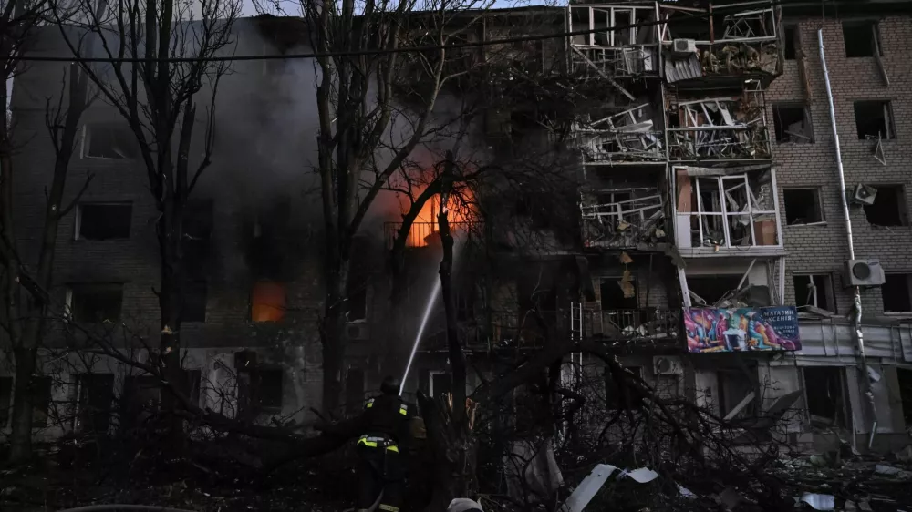 A firefighter works at the site of an apartment building hit during a Russian drone and missile strike, amid Russia's attack on Ukraine, in Zaporizhzhia, Ukraine August 30, 2025. REUTERS/Stringer