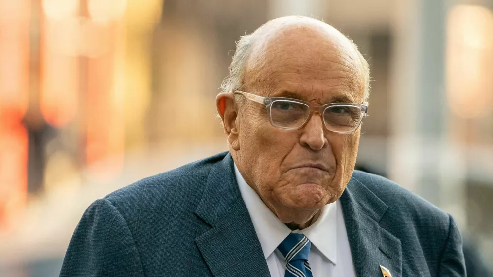 FILE PHOTO: Former New York City Mayor and former lawyer for U.S. President-elect Donald Trump, Rudy Giuliani walks outside United States District Court in Manhattan, where a judge will consider a request by two Georgia election workers to whom he owes $148 million for defamation to hold him in civil contempt for failing to turn over his assets, in New York City, U.S., January 3, 2025. REUTERS/David Dee Delgado/File Photo