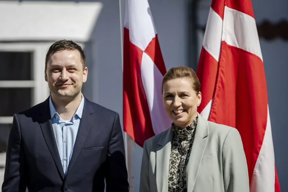 Denmark's Prime Minister Mette Frederiksen, right, and Greenland's Prime Minister Jens-Frederik Nielsen smile during thier a meeting at Marienborg in Kongens Lyngby, Denmark, Sunday, April 27, 2025. (Mads Claus Rasmussen/Ritzau Scanpix via AP)