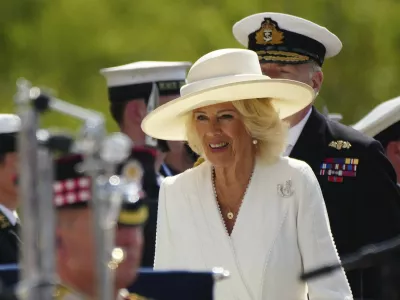 FILE - Britain's Queen's Camilla arrives for the commemoration of the 80th Anniversary of VJ Day at The National Memorial Arboretum on Aug. 15, 2025, in Alrewas, England. (Christopher Furlong/Pool Photo via AP, File)