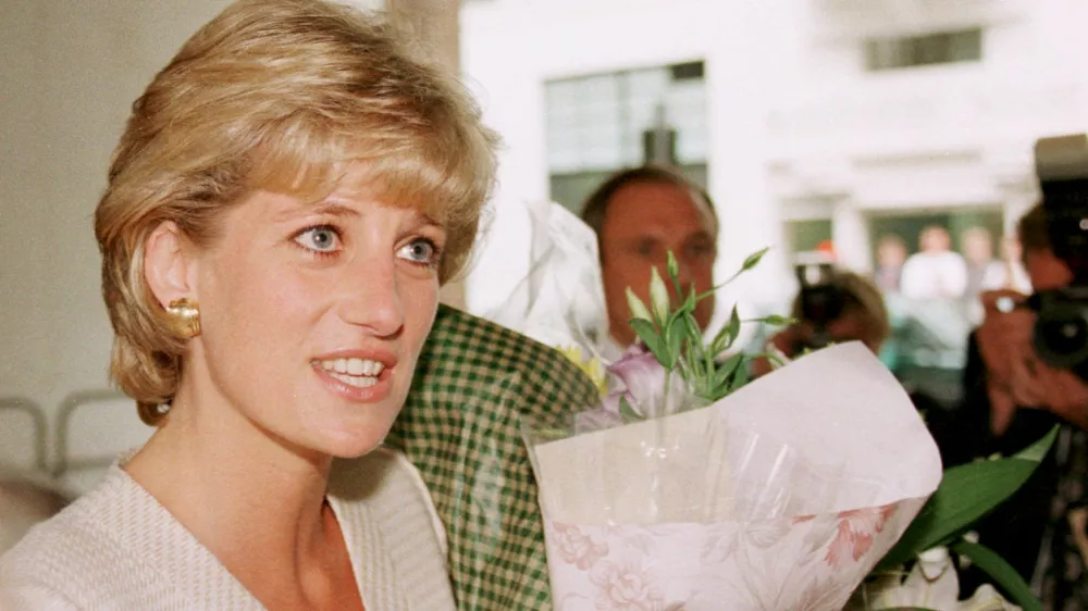 The Princess of Wales goes on a walkabout outside the Mortimer Market Centre in London, which she visited as patron of the National Aids Trust, Thursday June 27, 1996. The Princess heard about the latest developments in treatment and care for people with HIV/AIDS and she met staff and patients at the clinic. (AP Photo/Louisa Buller)