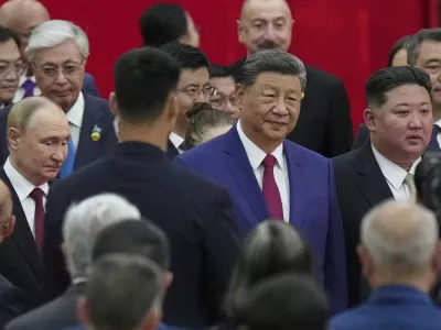 Chinese President Xi Jinping, centre, walks with North Korean leader Kim Jong Un, right, and Russian President Vladimir Putin, left, to a reception following a military parade to commemorate the 80th anniversary of Japan's World War II surrender held in front of Tiananmen Gate in Beijing, Wednesday, Sept. 3, 2025. (AP Photo/Mahesh Kumar)