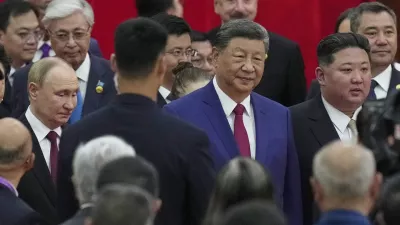 Chinese President Xi Jinping, centre, walks with North Korean leader Kim Jong Un, right, and Russian President Vladimir Putin, left, to a reception following a military parade to commemorate the 80th anniversary of Japan's World War II surrender held in front of Tiananmen Gate in Beijing, Wednesday, Sept. 3, 2025. (AP Photo/Mahesh Kumar)