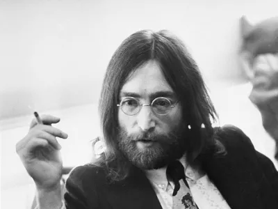 Musician John Lennon of the Beatles relaxing with a cigarette.