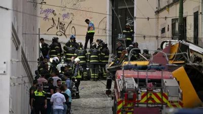 First responders work at the site of an accident involving Lisbon's Gloria funicular, a popular tourist attraction, which derailed and crashed, resulting in fatalities and injuries, according to authorities, in Lisbon, Portugal, September 3, 2025. REUTERS/Stringer