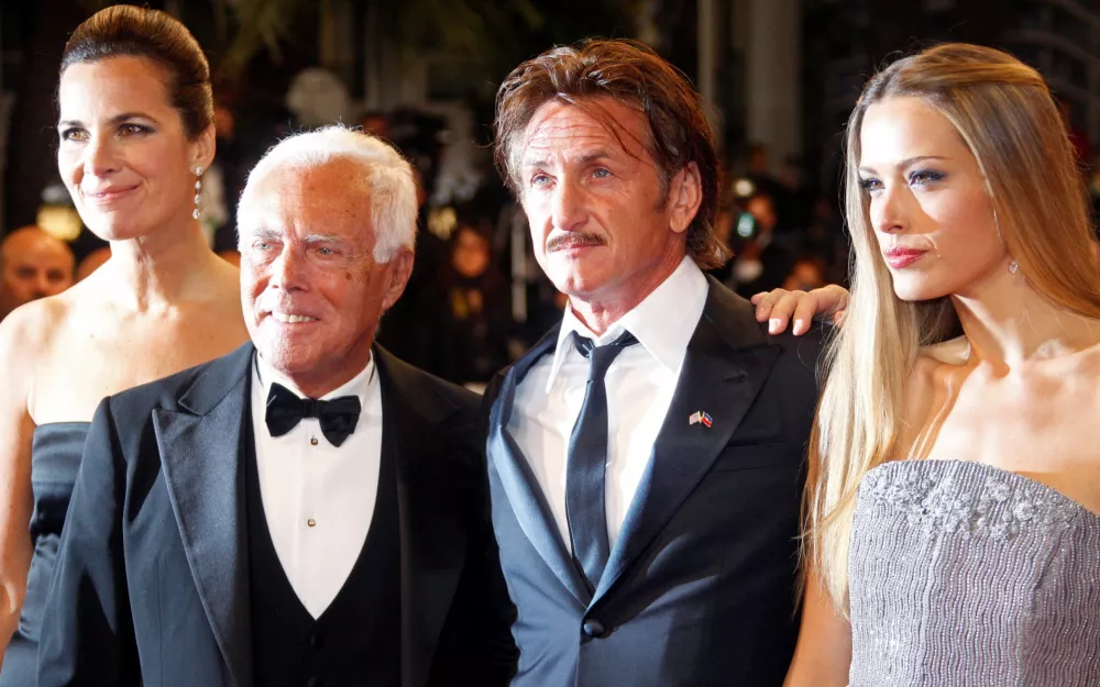 FILE PHOTO: Roberta Armani, Giorgio Armani, actor Sean Penn and model Petra Nemcova pose on the red carpet ahead of the "Haiti Carnaval in Cannes" event at the 65th Cannes Film Festival May 18, 2012. REUTERS/Christian Hartmann/File Photo