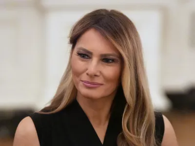 First lady Melania Trump attends a dinner with President Donald Trump in the State Dinning Room of the White House, Thursday, Sept. 4, 2025, in Washington. (AP Photo/Alex Brandon)
