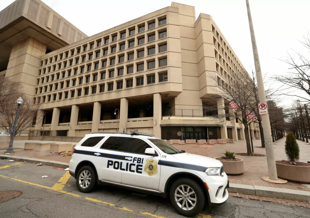 FILE PHOTO: An FBI police car stands outside FBI headquarters, days after the Trump administration launched a sweeping round of cuts at the Justice Department, in Washington, U.S., February 3, 2025. REUTERS/Kevin Lamarque/File Photo