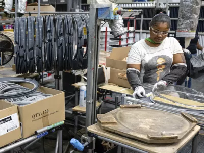FILE - An employee pieces together components on an assembly line at GE Appliances global headquarters, Wednesday, Aug 13, 2025, in Louisville, Ky. (AP Photo/Jon Cherry, File)