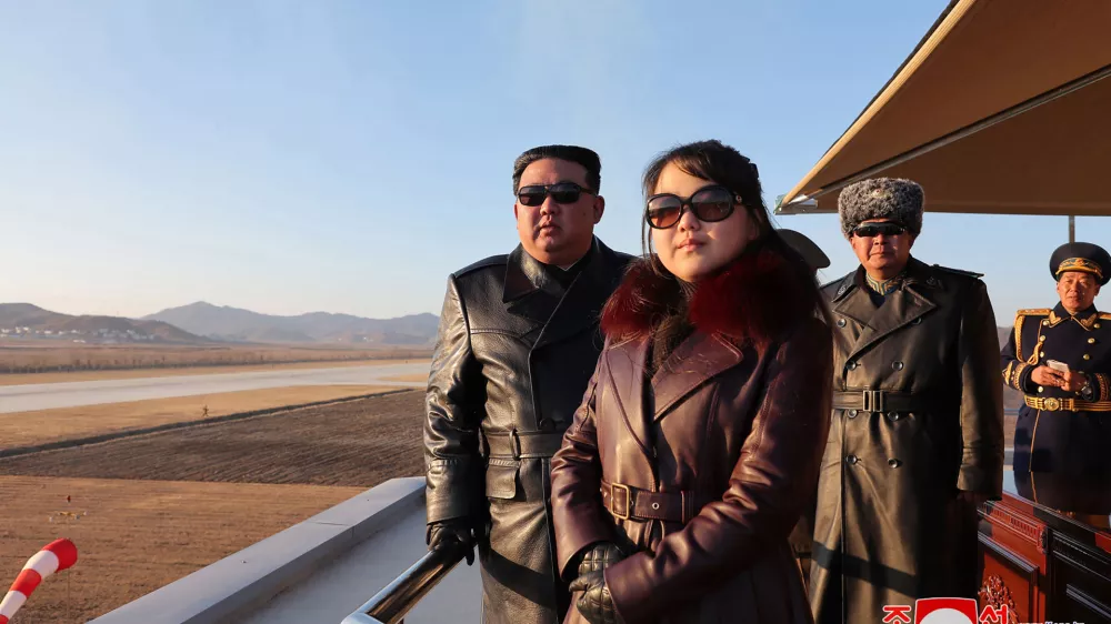 This picture taken on November 30, 2023 and released from North Korea's official Korean Central News Agency (KCNA) via KNS on December 1, 2023 shows North Korea's leader Kim Jong Un (L) and his daughter (C), presumed to be named Ju Ae, observing an air festival during a visit with the 1st Air Force Division Flying Regiment of the Korean People's Army to commemorate Air Day, at an unknown location.,Image: 825710791, License: Rights-managed, Restrictions: South Korea OUT / REPUBLIC OF KOREA OUT---EDITORS NOTE--- RESTRICTED TO EDITORIAL USE - MANDATORY CREDIT "AFP PHOTO/KCNA VIA KNS" - NO MARKETING NO ADVERTISING CAMPAIGNS - DISTRIBUTED AS A SERVICE TO CLIENTS / THIS PICTURE WAS MADE AVAILABLE BY A THIRD PARTY. AFP CAN NOT INDEPENDENTLY VERIFY THE AUTHENTICITY, LOCATION, DATE AND CONTENT OF THIS IMAGE ---, ***HANDOUT image or SOCIAL MEDIA IMAGE or FILMSTILL for EDITORIAL USE ONLY! * Please note: Fees charged by Profimedia are for the Profimedia's services only, and do not, nor are they intended to, convey to the user any ownership of Copyright or License in the material. Profimedia does not claim any ownership including but not limited to Copyright or License in the attached material. By publishing this material you (the user) expressly agree to indemnify and to hold Profimedia and its directors, shareholders and employees harmless from any loss, claims, damages, demands, expenses (including legal fees), or any causes of action or allegation against Profimedia arising out of or connected in any way with publication of the material. Profimedia does not claim any copyright or license in the attached materials. Any downloading fees charged by Profimedia are for Profimedia's services only. * Handling Fee Only ***, Model Release: no