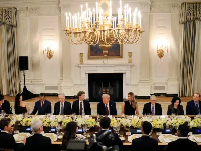 U.S. President Donald Trump and First Lady Melania Trump host a private dinner for technology and business leaders in the State Dining Room at the White House in Washington, D.C., U.S., September 4, 2025. REUTERS/Brian Snyder