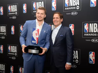June 24, 2019; Los Angeles, CA, USA; Dallas Mavericks guard Luka Doncic poses with owner Mark Cuban following his award for Rookie Of The Year at the 2019 NBA Awards show at Barker Hanger. Mandatory Credit: Gary A. Vasquez-USA TODAY Sports - 12952404