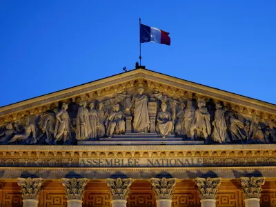 A French flag flutters on top of the National Assembly ahead of a confidence vote that the French Prime Minister Francois Bayrou seeks on the budget issue, in Paris, France, September 6, 2025. REUTERS/Abdul Saboor   TPX IMAGES OF THE DAY