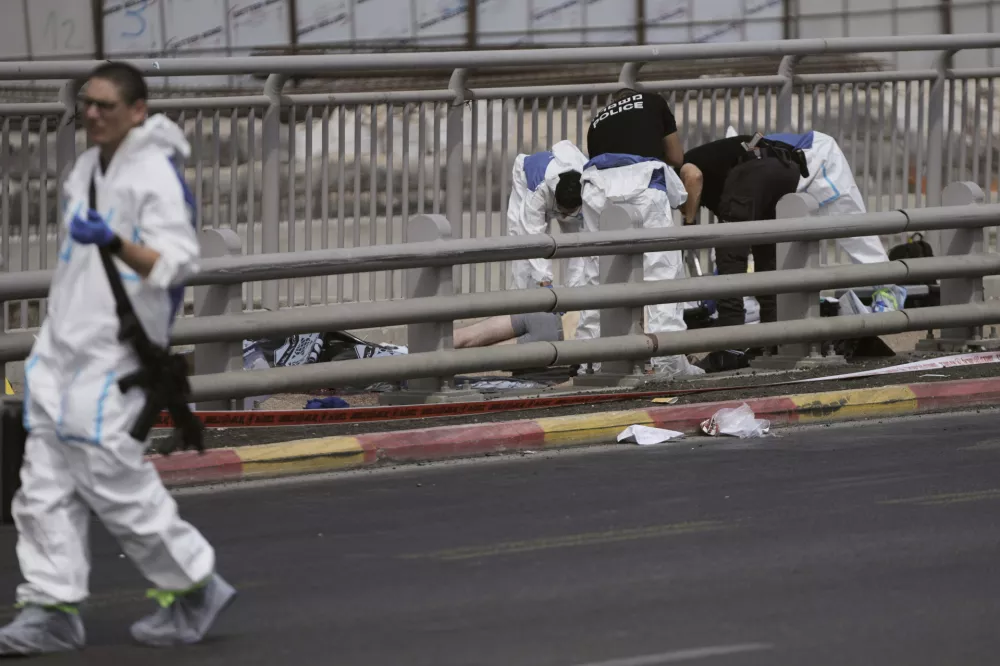 Israeli police and rescue teams respond at the scene of a shooting attack where several people killed and injured in Jerusalem, Monday, Sept. 8, 2025. (AP Photo/Mahmoud Illean)