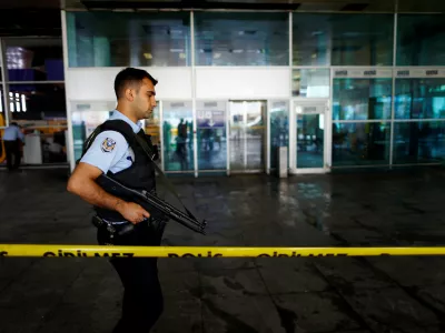 A police officer patrols at Turkey's largest airport, Istanbul Ataturk, following yesterday's blast June 29, 2016. REUTERS/Osman Orsal