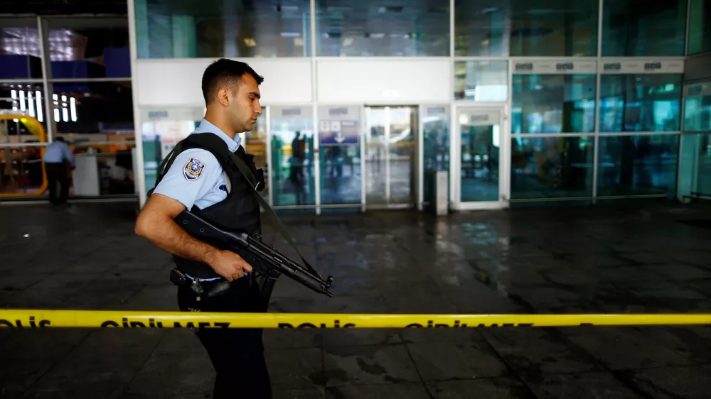 A police officer patrols at Turkey's largest airport, Istanbul Ataturk, following yesterday's blast June 29, 2016. REUTERS/Osman Orsal