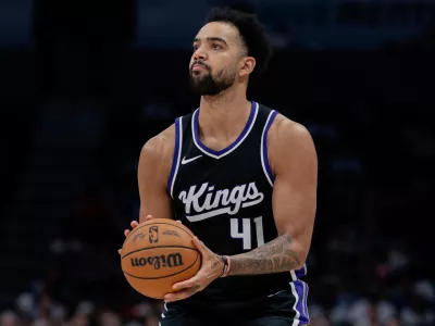 FILE - Sacramento Kings forward Trey Lyles (41) shoots the ball against the Charlotte Hornets during the second half of an NBA basketball game Friday, April 4, 2025, in Charlotte, N.C. (AP Photo/Jacob Kupferman, File)