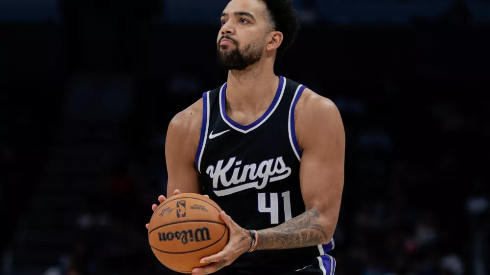 FILE - Sacramento Kings forward Trey Lyles (41) shoots the ball against the Charlotte Hornets during the second half of an NBA basketball game Friday, April 4, 2025, in Charlotte, N.C. (AP Photo/Jacob Kupferman, File)