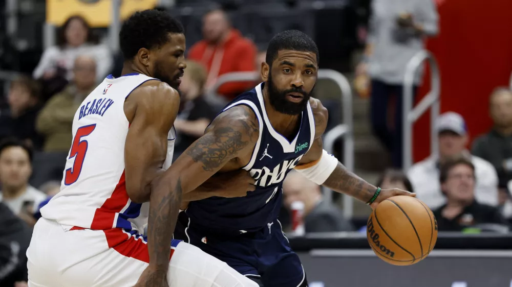 Jan 31, 2025; Detroit, Michigan, USA; Dallas Mavericks guard Kyrie Irving (11) is defended by Detroit Pistons guard Malik Beasley (5) in the first half at Little Caesars Arena. Mandatory Credit: Rick Osentoski-Imagn Images