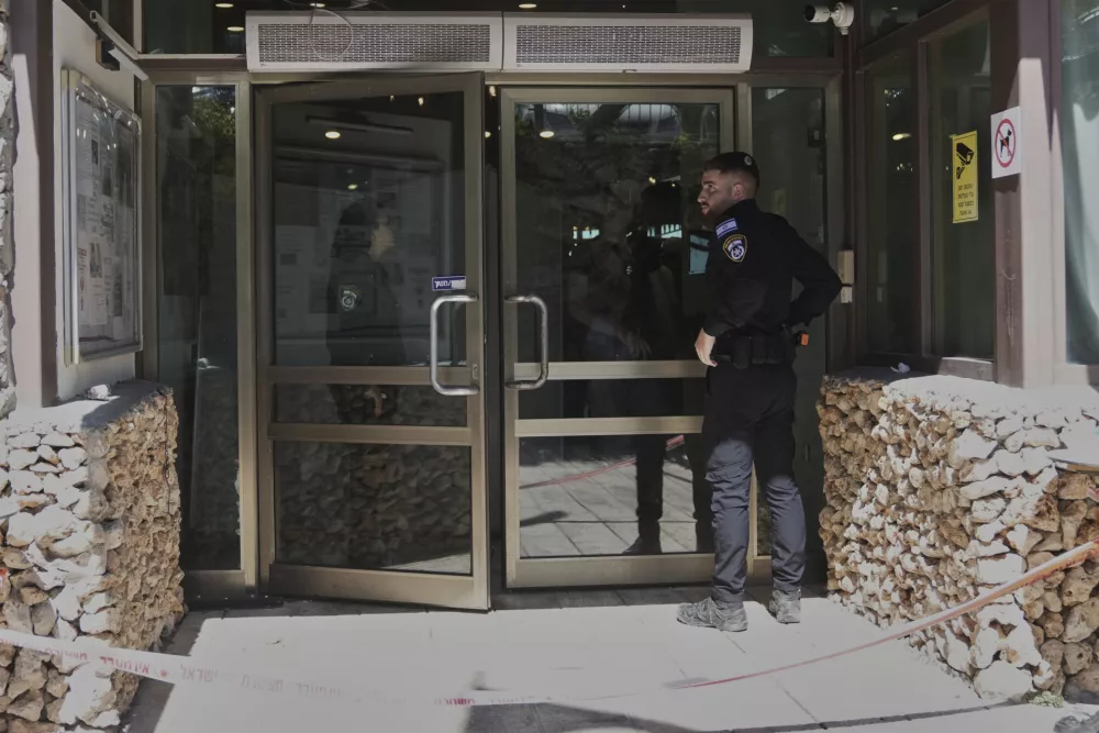 Members of the Israeli security forces work at the scene of a stabbing attack at a hotel in the Kibbutz Tzova, outside Jerusalem, Friday, Sept. 12, 2025. (AP Photo/Mahmoud Illean)