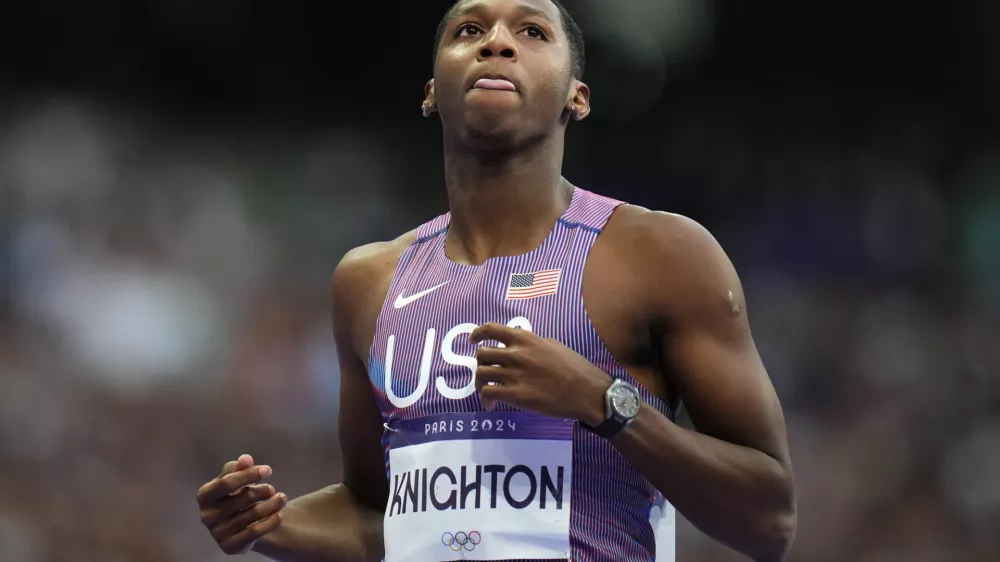 FILE - Erriyon Knighton, of the United States, reacts following his men's 200-meter semifinal at the 2024 Summer Olympics, on Aug. 7, 2024, in Saint-Denis, France. (AP Photo/Petr David Josek, File)