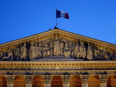 A French flag flutters on top of the National Assembly ahead of a confidence vote that the French Prime Minister Francois Bayrou seeks on the budget issue, in Paris, France, September 6, 2025. REUTERS/Abdul Saboor   TPX IMAGES OF THE DAY