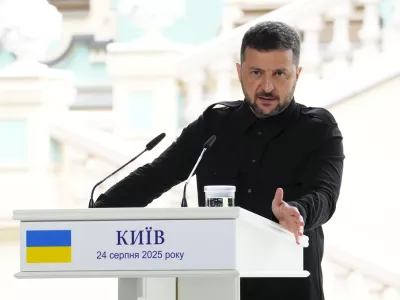 Ukrainian President Volodymyr Zelenskyy answers a question as he joins Prime Minister Mark Carney for a joint press conference at Mariinskyi Palace in Kyiv, Ukraine on Sunday, Aug. 24, 2025. (Sean Kilpatrick/The Canadian Press via AP) 