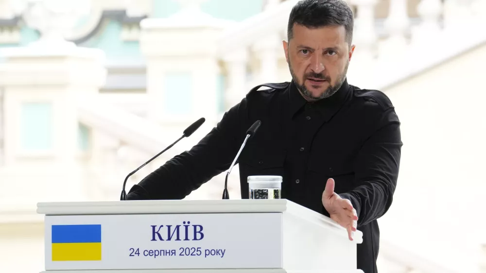 Ukrainian President Volodymyr Zelenskyy answers a question as he joins Prime Minister Mark Carney for a joint press conference at Mariinskyi Palace in Kyiv, Ukraine on Sunday, Aug. 24, 2025. (Sean Kilpatrick/The Canadian Press via AP) 