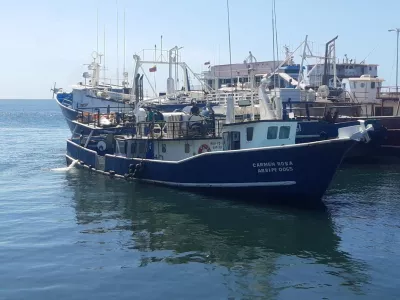 People stand aboard Venezuelan fishing vessel "Carmen Rosa", which, according to the Venezuelan government was allegedly intercepted by a U.S. warship in Caribbean waters on Friday, in this handout image taken at an unidentified location and released on September 13, 2025. Venezuela's Ministry of Communication and Information/Handout via REUTERS  THIS IMAGE HAS BEEN SUPPLIED BY A THIRD PARTY. MANDATORY CREDIT. NO RESALES. NO ARCHIVES. VENEZUELA OUT. NO COMMERCIAL OR EDITORIAL SALES IN VENEZUELA. VERIFICATION - Reuters was not able to independently verify the location and date.
