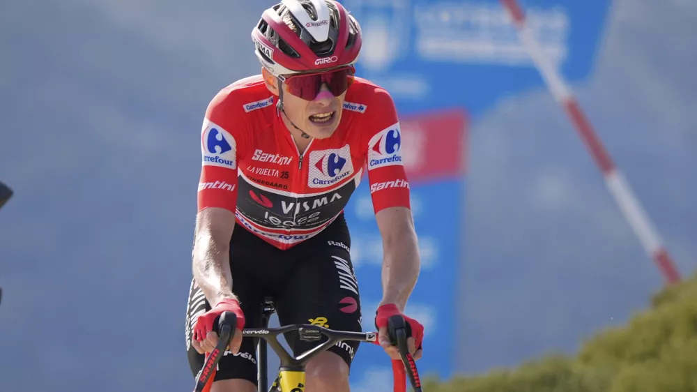 Danish cyclist Jonas Vingegaard completes the final meters before winning the 20th stage and his first overall victory in the Spanish cycling race La Vuelta, from Robledo de Chavela to Bola del Mundo, in Puerto de Navacerrada, Spain, on Saturday, September 13, 2025. (AP Photo/Manu Fern&aacute;ndez)