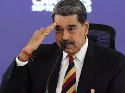 Venezuela President Nicolas Maduro salutes during a press conference in Caracas, Venezuela, Monday, Sept. 1, 2025. (AP Photo/Ariana Cubillos)