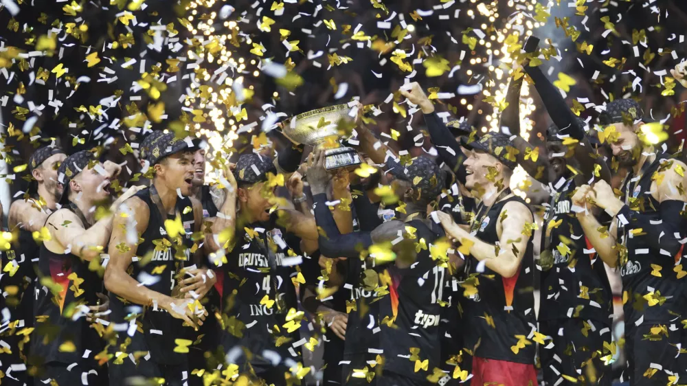 Germany players celebrate after winning the Eurobasket, European Basketball Championship final match between Turkey and Germany at the Riga Arena in Riga, Latvia, Sunday, Sept. 14, 2025. (AP Photo/Sergei Grits)