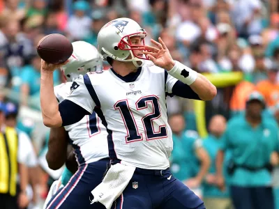 Dec 9, 2018; Miami Gardens, FL, USA; New England Patriots quarterback Tom Brady (12) throws a pass against the Miami Dolphins during the first half at Hard Rock Stadium. Mandatory Credit: Steve Mitchell-USA TODAY Sports