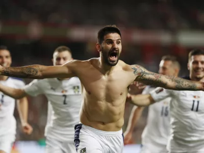 Soccer Football - World Cup - UEFA Qualifiers - Group A - Portugal v Serbia - Estadio da Luz, Lisbon, Portugal - November 14, 2021 Serbia's Aleksandar Mitrovic celebrates scoring their second goal REUTERS/Pedro Nunes
