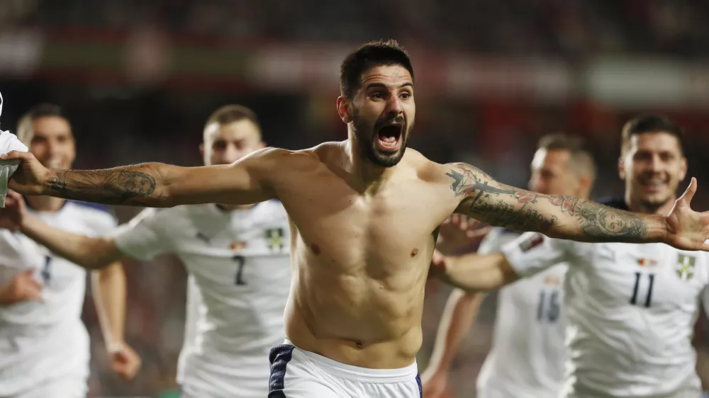 Soccer Football - World Cup - UEFA Qualifiers - Group A - Portugal v Serbia - Estadio da Luz, Lisbon, Portugal - November 14, 2021 Serbia's Aleksandar Mitrovic celebrates scoring their second goal REUTERS/Pedro Nunes