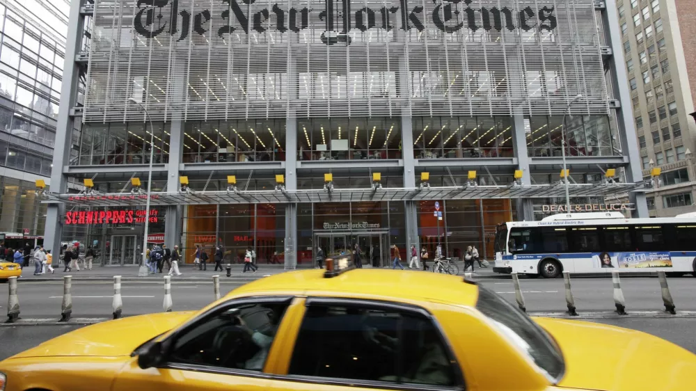 FILE - In this Tuesday, Oct. 18, 2011, file photo, traffic passes the New York Times building, in New York. The New York Times Co. reports financial earnings on Wednesday, May 3, 2017. (AP Photo/Mark Lennihan, File)