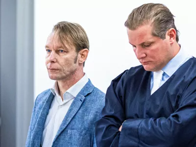 A man, who is a suspect in the disappearance of British toddler Madeleine McCann in Portugal, stands next to his lawyer Friedrich Fuelscher at his trial on unrelated sexual assault charges in Braunschweig, Germany, October 2, 2024. Christian B., is charged with three counts of aggravated rape and two counts of sexual abuse of children in Portugal between June 2007 and December 2000.   Moritz Frankenberg/Pool via REUTERS