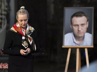 FILE -Yulia Navalnaya, widow of Russian opposition leader Alexei Navalny walks away from his picture after lighting a candle at the end of a service in St. Mary's Church on the occasion of his birthday, in Berlin, June 4, 2024. (Christoph Gollnow/dpa/dpa via AP, File)
